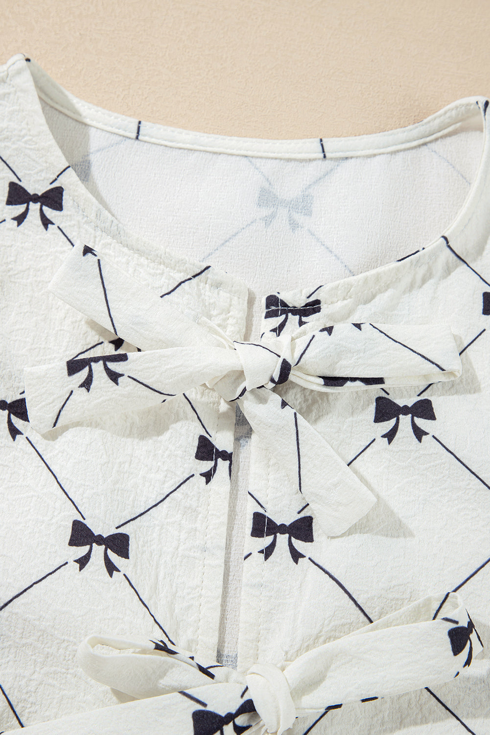 Bow print bubble sleeve top