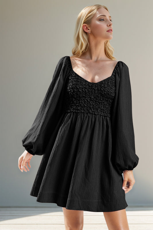 Black smocked mini dress